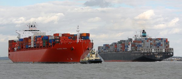 Container ships pass in Gravesend Reach